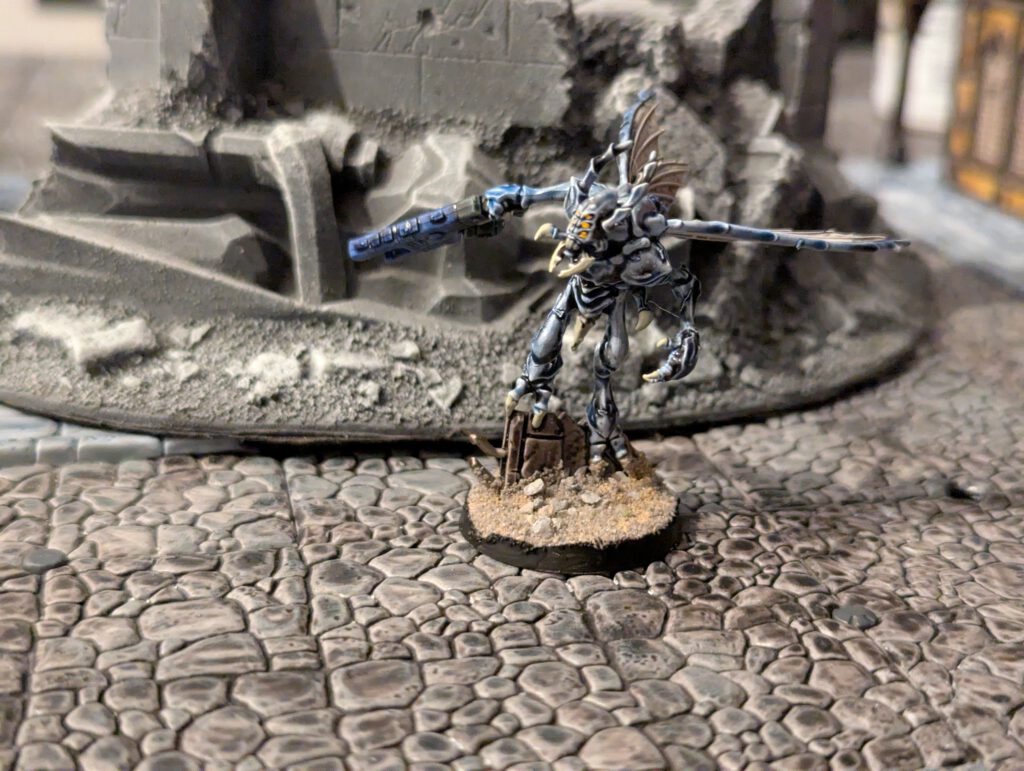 Front view of a painted Vespid Stingwing in mid-flight pose