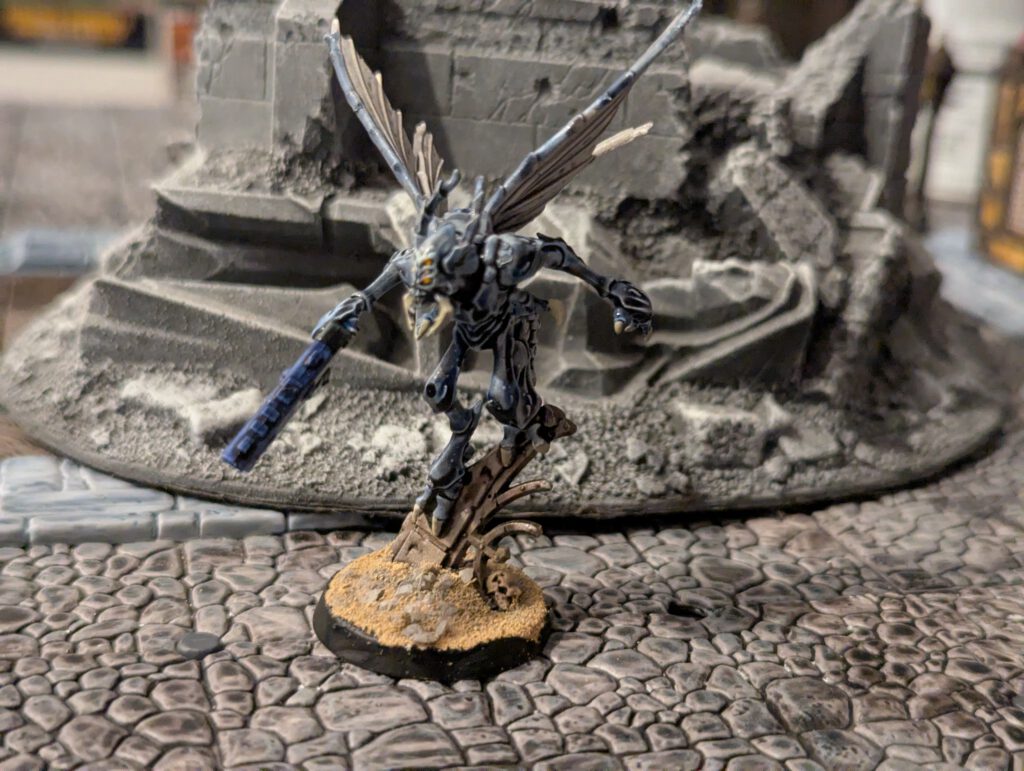Painted Vespid Stingwing standing on ruins
