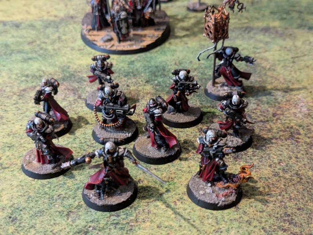 Second Battle Sisters squad in matching color scheme, viewed from slightly elevated front angle.