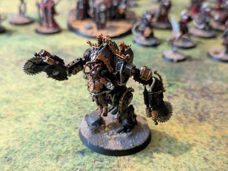 Painted Penitent Engine with saws and flails, top-front view capturing mechanical detail.