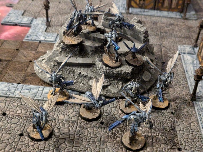 Full Vespid Stingwing squad painted in greyish blue on rocky bases