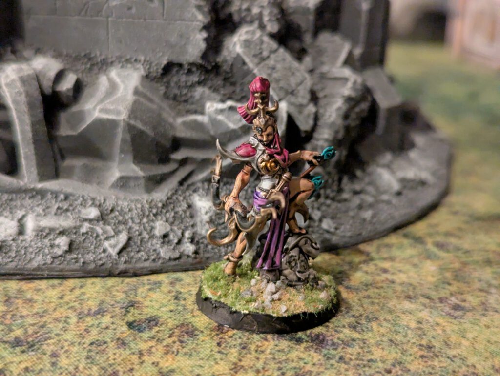 Painted Blissbarb Archer in dynamic pose with drawn arrow, top-front view.