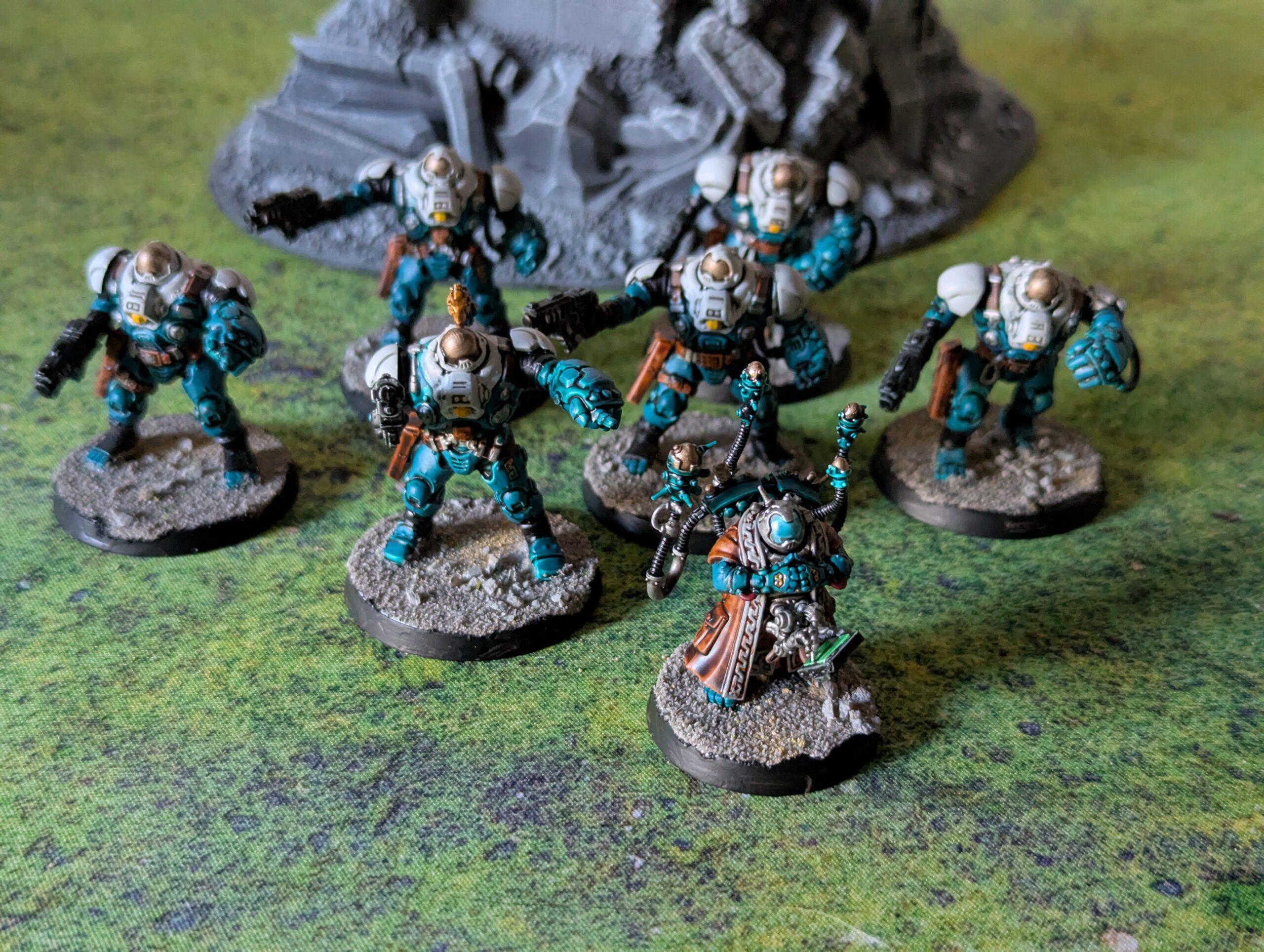 Painted Ironkin Steeljacks with gauntlets and a Memnyr Strategist displayed together in a group shot, viewed from a top-front angle.