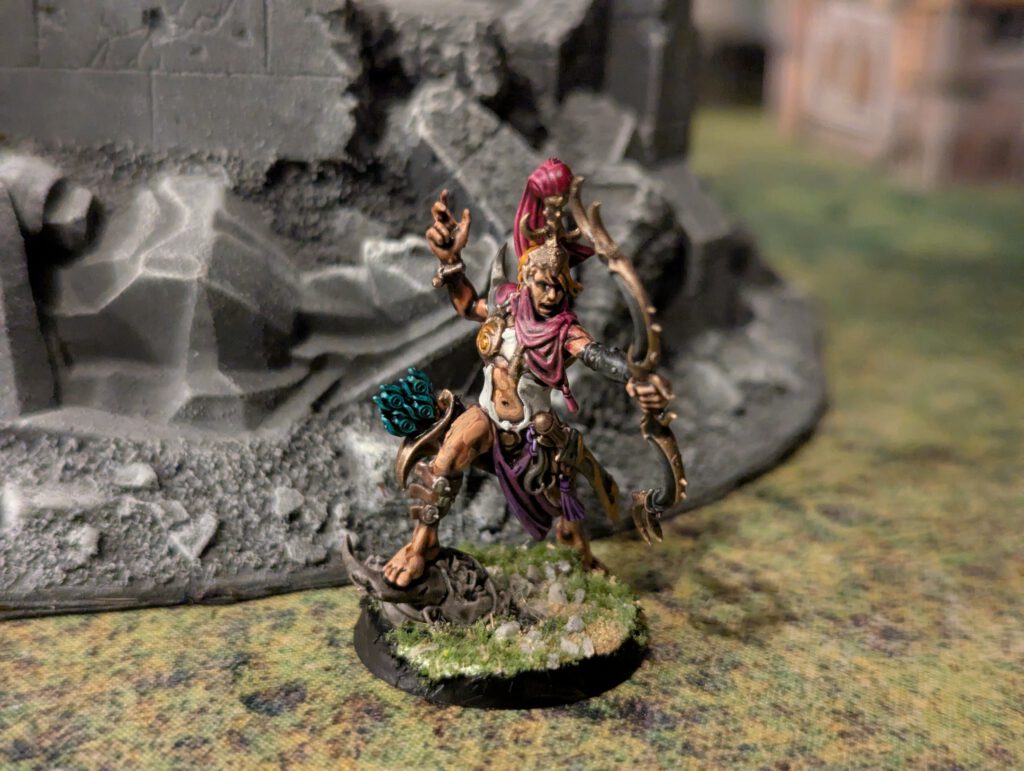 Painted Blissbarb Archer with ornate Slaanesh detailing, top-front view.