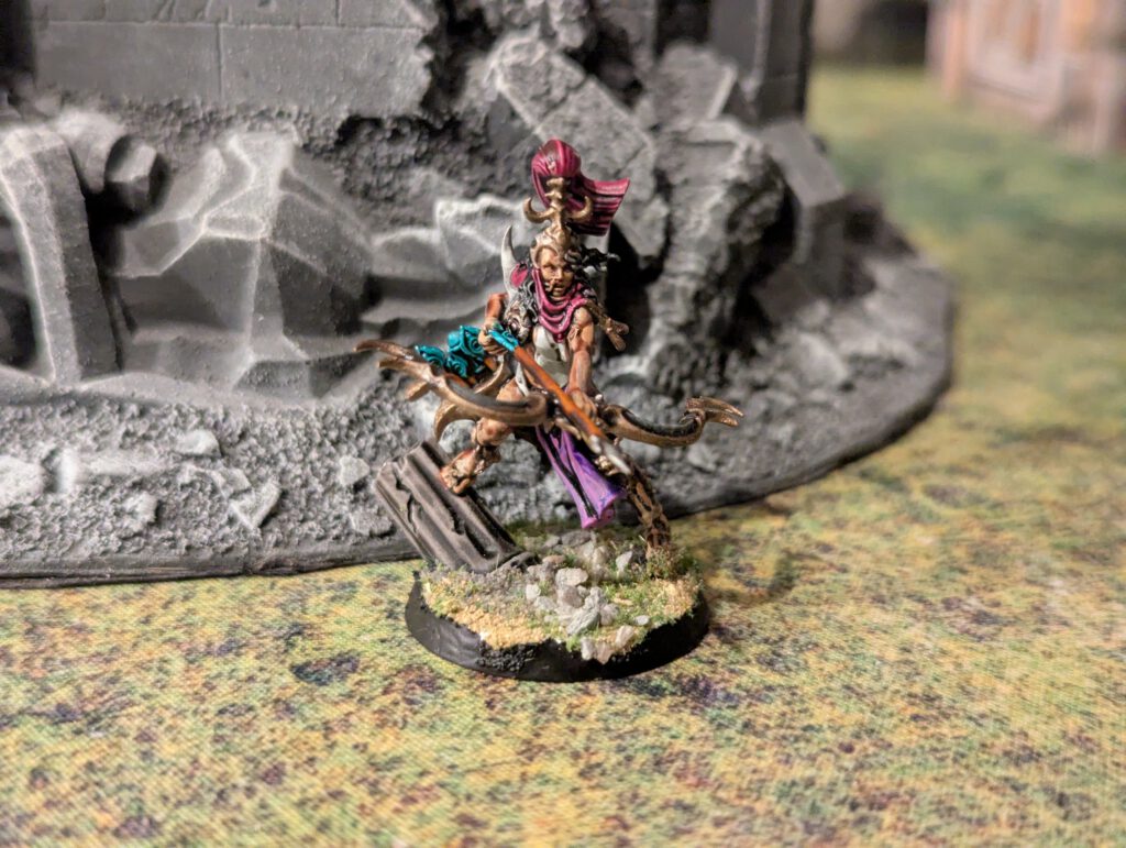 Painted Blissbarb Archer preparing to fire, viewed from slightly elevated front angle.