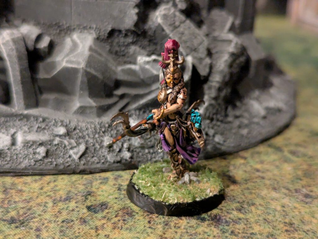 Painted Blissbarb Archer pulling an arrow on the bow, front angle.