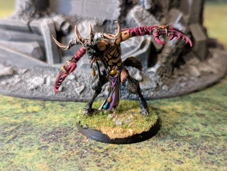 Painted Slaangor with ornate armor and horns, viewed from slightly elevated front angle.