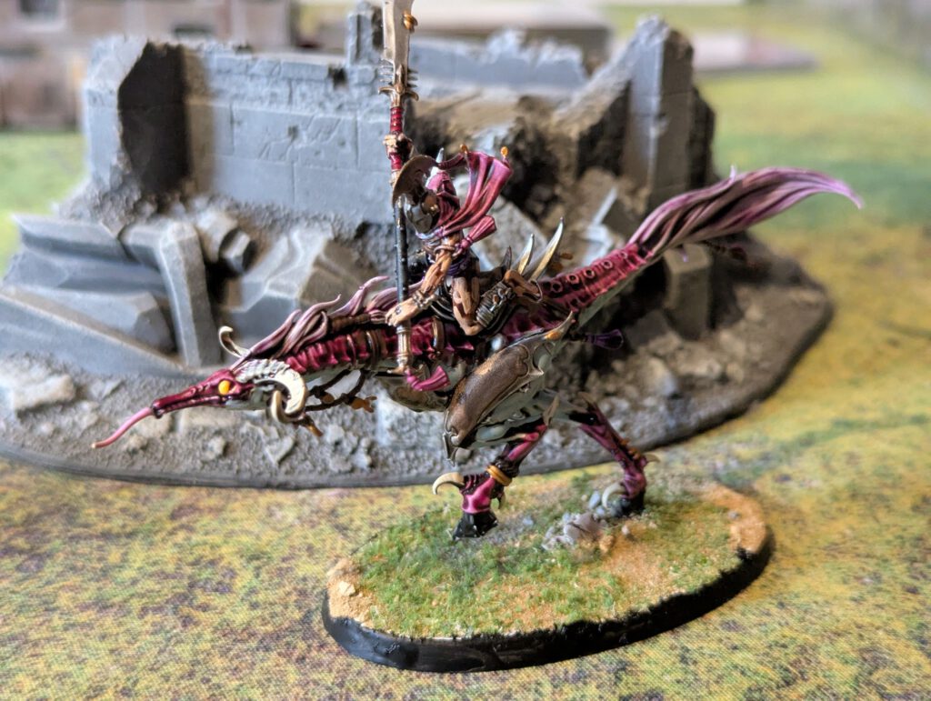 Painted Slickblade Seeker in dynamic cavalry pose, viewed from top-front angle.