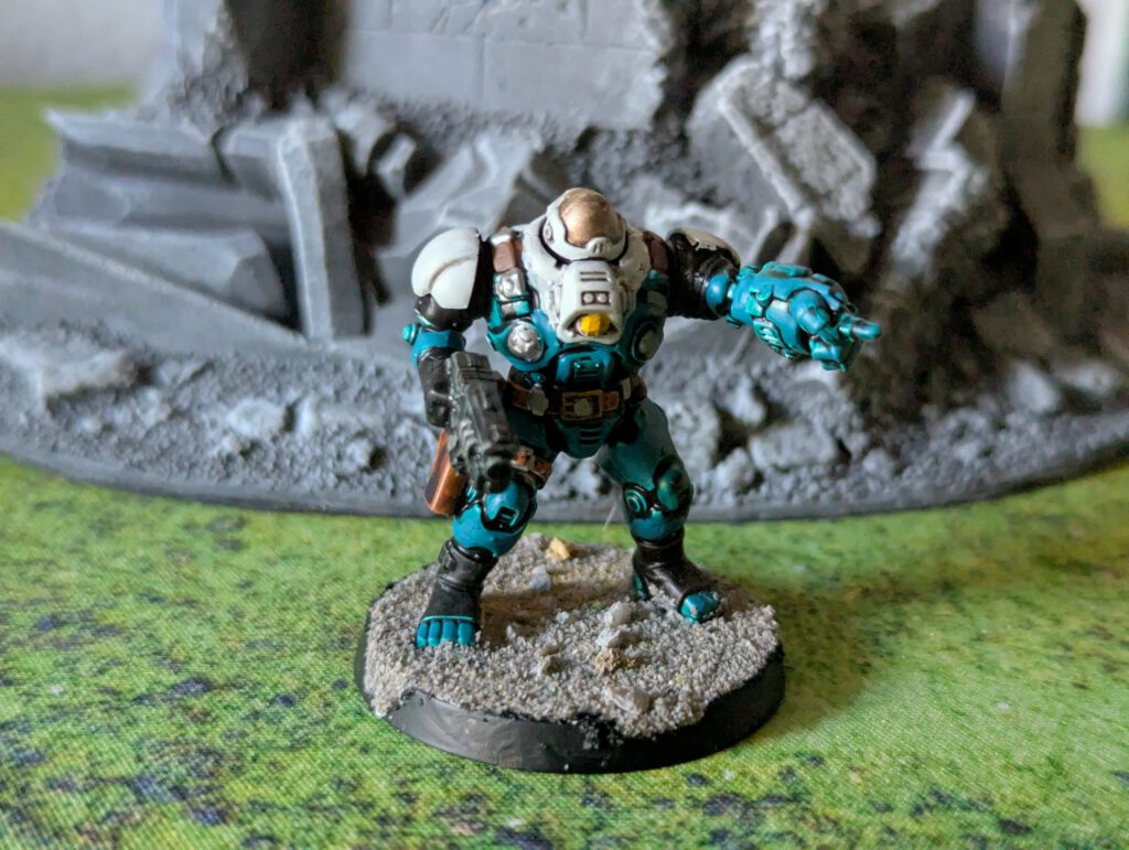 Painted Ironkin Steeljack with gauntlet in pose A, viewed from a top-front angle.
