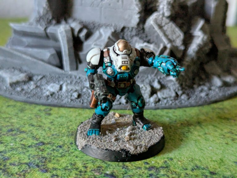 Painted Ironkin Steeljack with gauntlet in pose A, viewed from a top-front angle.