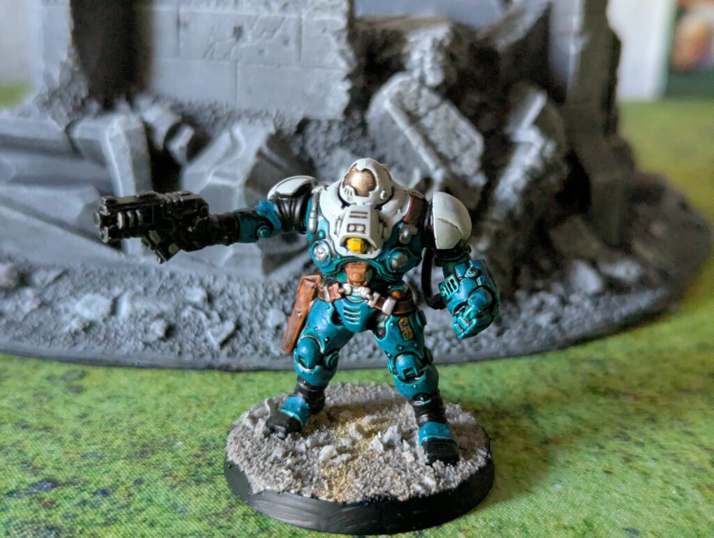 Painted Ironkin Steeljack with gauntlets in pose B, viewed from a top-front angle.