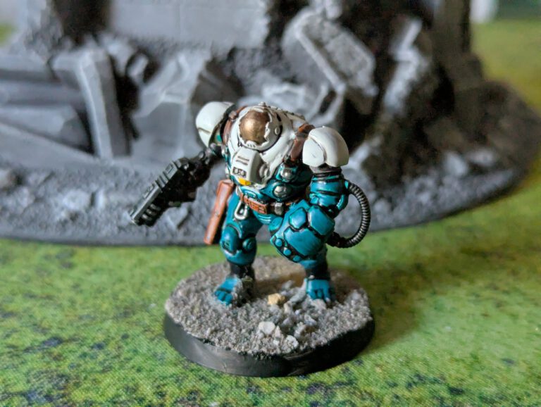 Painted Ironkin Steeljack with gauntlets in pose C, viewed from a top-front angle.
