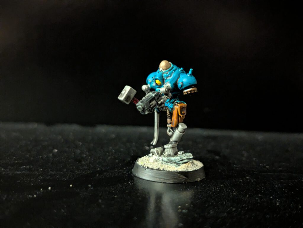 Painted Brokhyr E-COG with hammer and pistol, viewed from a front angle.