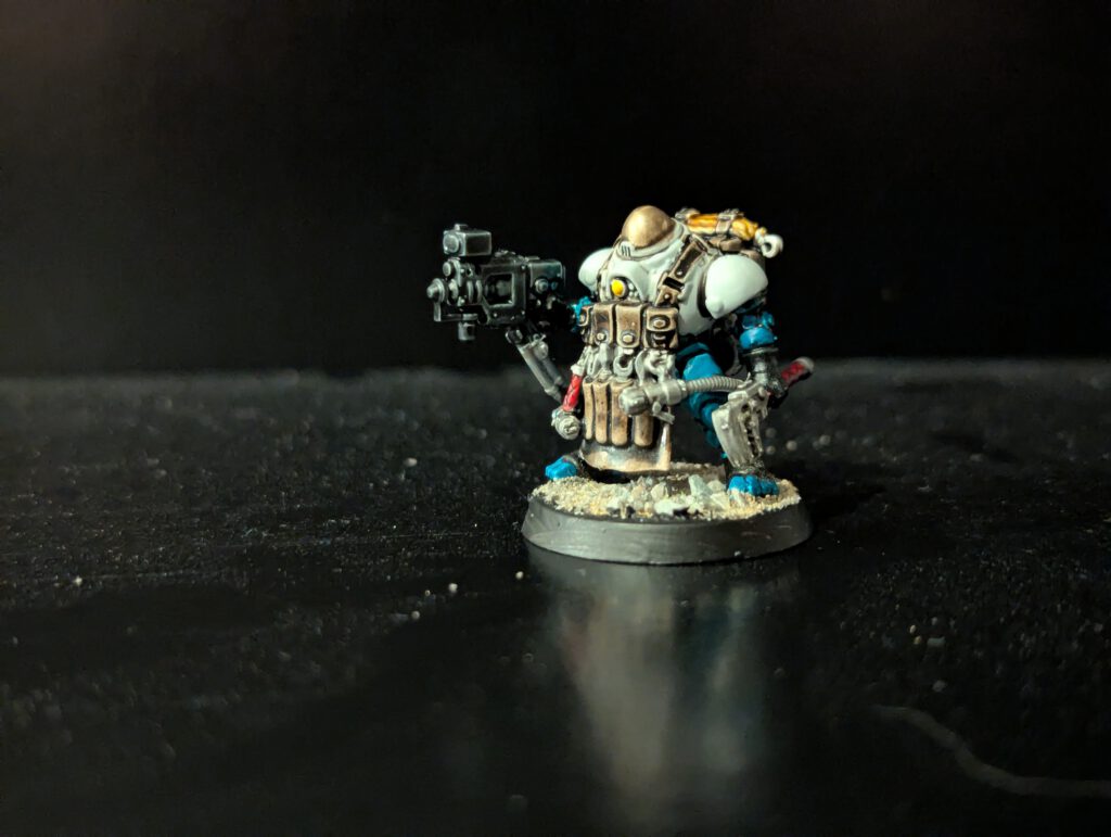 Painted Ironkin assistant accompanying the Brokhyr Iron-Master, viewed from a front angle.