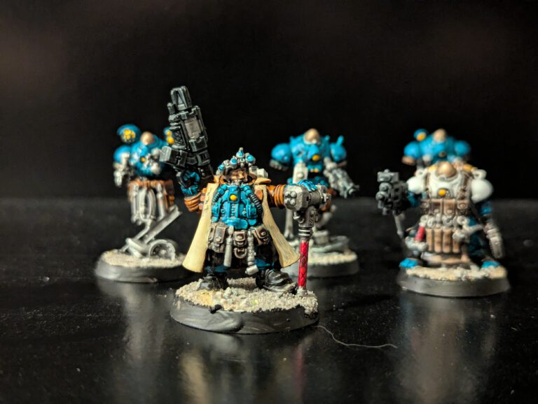 Painted Brokhyr Iron-Master with Ironkin assistant and E-COGs displayed together, viewed from a top-front angle.