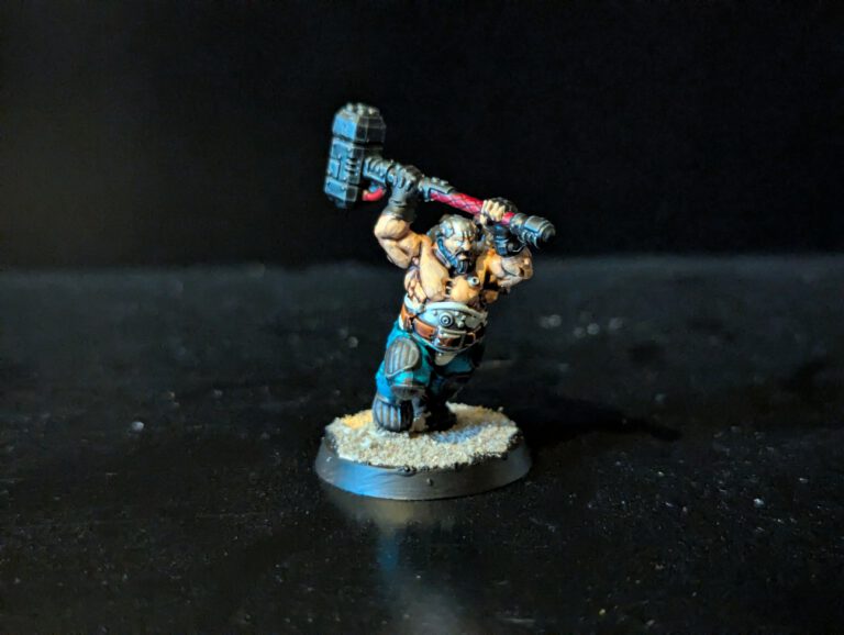 Painted Cthonian Berserk wielding a heavy hammer, viewed from a front angle.
