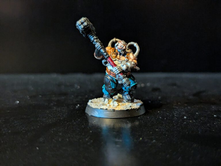 Painted Cthonian Berserk in an aggressive stance with hammer, viewed from a top-front angle.