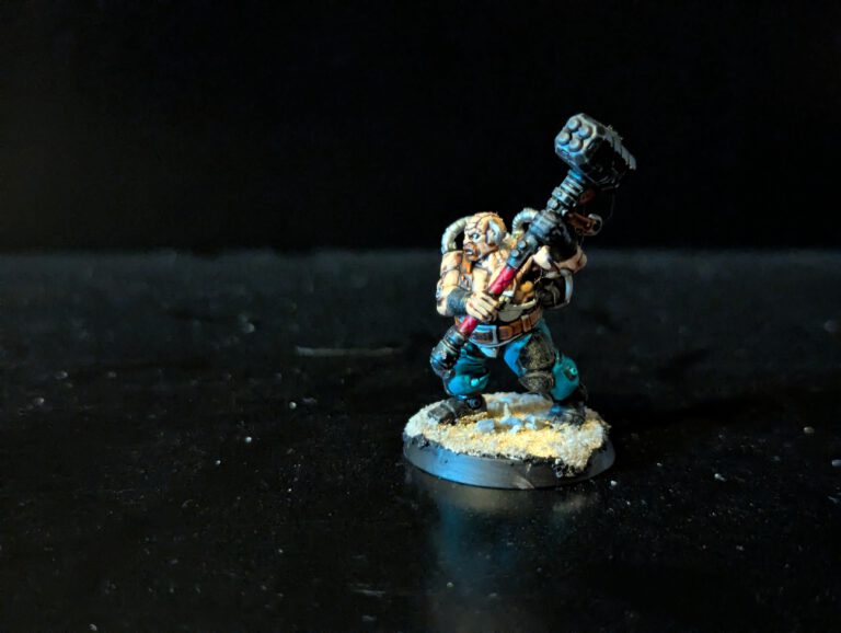 Painted Cthonian Berserk wielding a heavy hammer, viewed from a front angle.