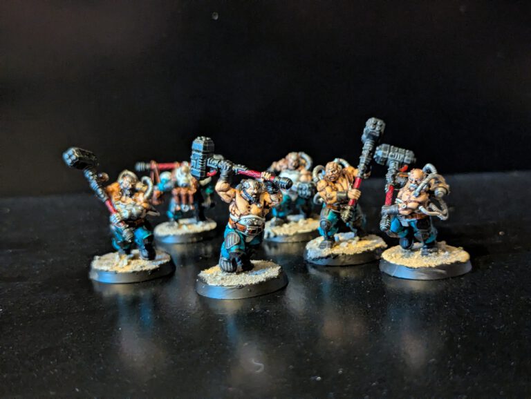 Painted Cthonian Berserks unit displayed together, viewed from a top-front angle.