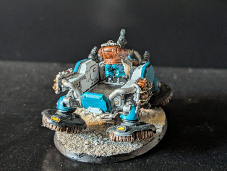 Painted Kapricus viewed from the back, showing backpack and rear armor details.