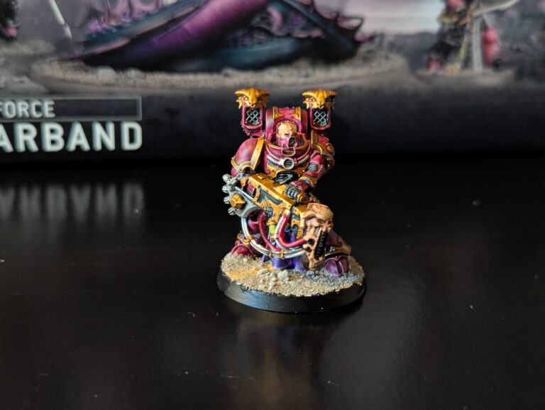 Painted Noise Marine firing sonic blaster, viewed from a slightly elevated front angle.