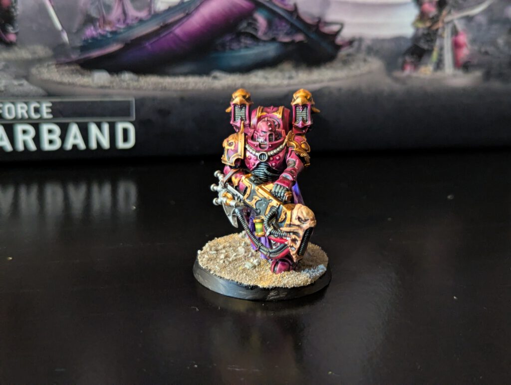 Painted Noise Marine in dynamic firing pose with ornate Slaanesh armor, front angle.