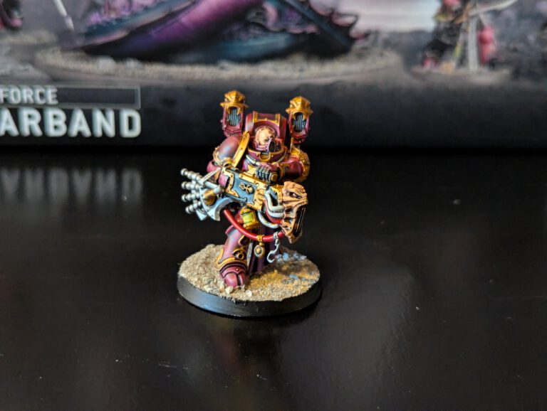 Painted Noise Marine advancing with sonic blaster raised, viewed from a front angle.