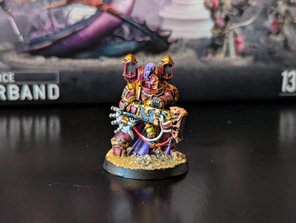 Painted Noise Marine with elaborate armor trim, shown from a slightly elevated front angle.