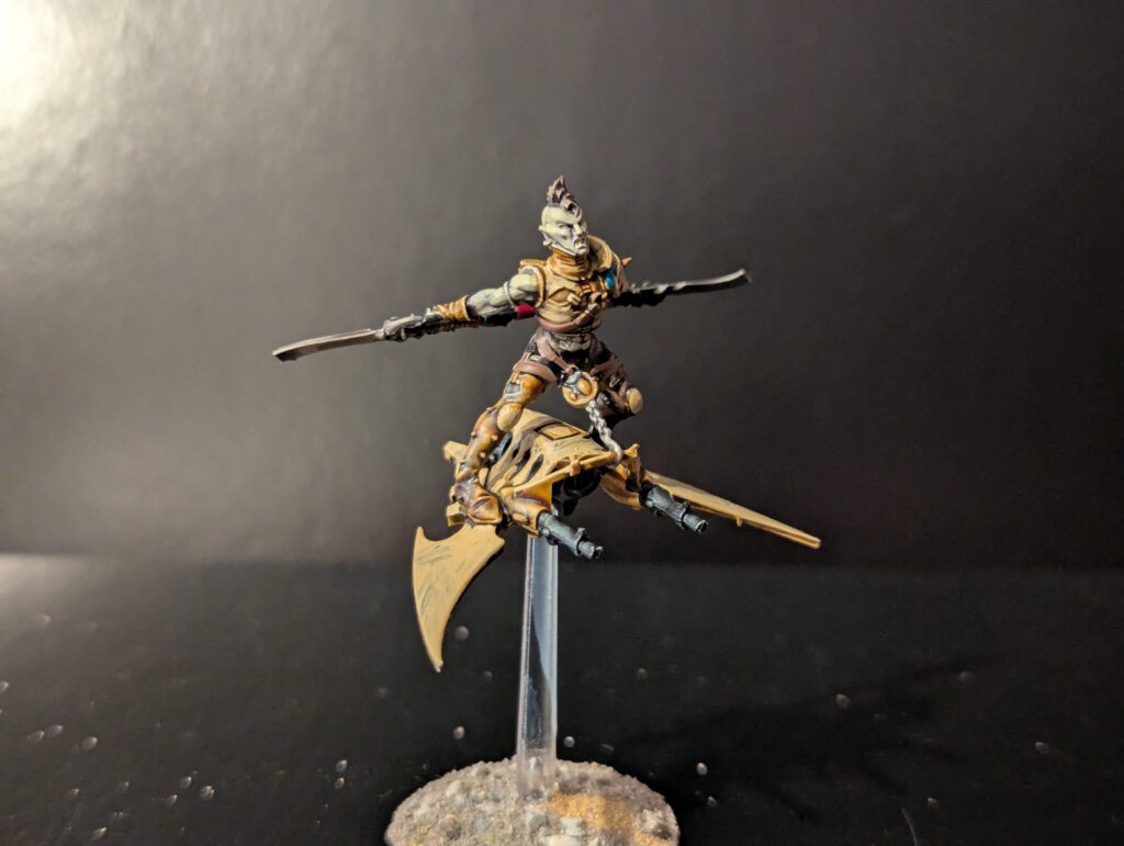 Painted Hellion with skyboard and glaive, viewed from a top-front angle.