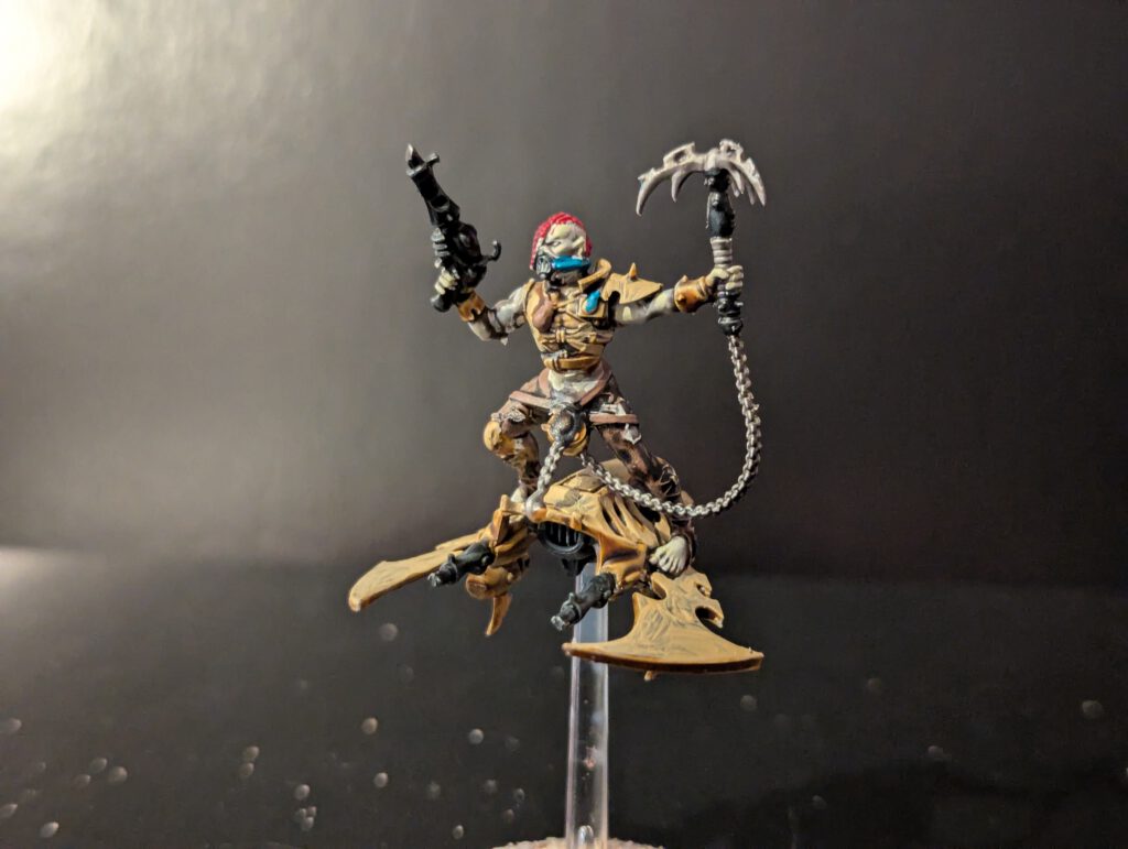 Painted Hellion mid-flight with weapon raised, viewed from a front angle.