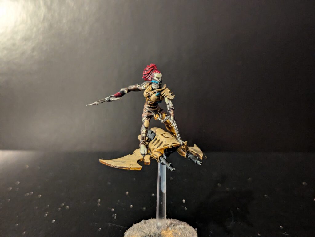 Painted Hellion showcasing motion and board details, viewed from a slightly elevated front angle.