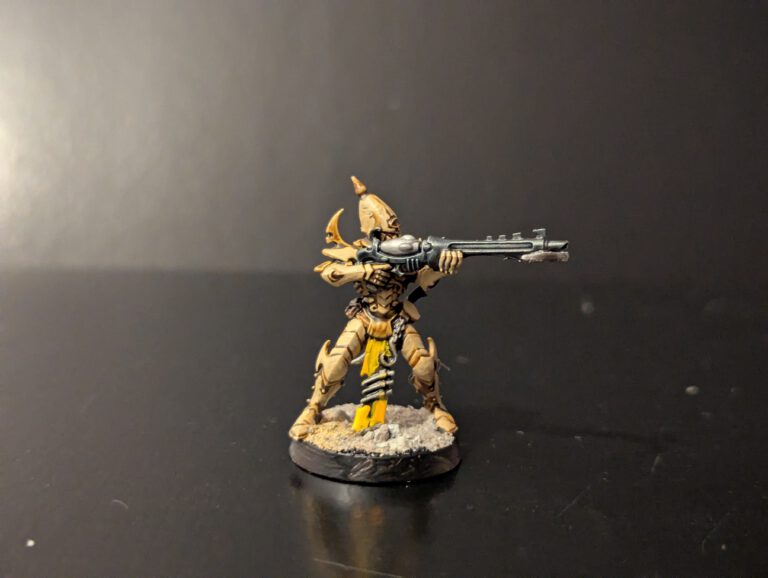 Painted Kabalite Warrior aiming splinter weapon, viewed from a top-front angle.
