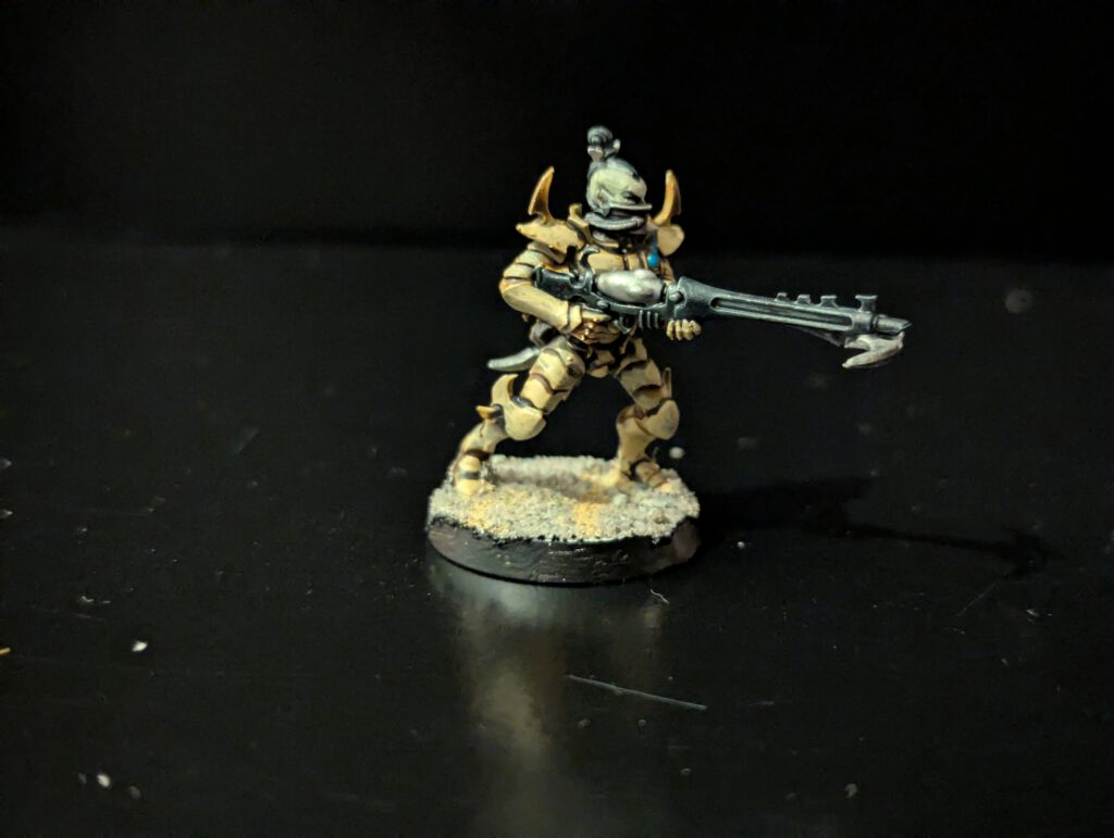 Painted Kabalite Warrior showcasing armor and weapon details, viewed from a slightly elevated front angle.