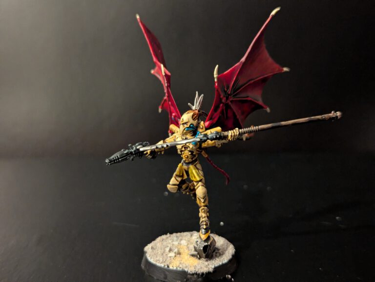 Painted Scourge with wings spread and ranged weapon, viewed from a front angle.