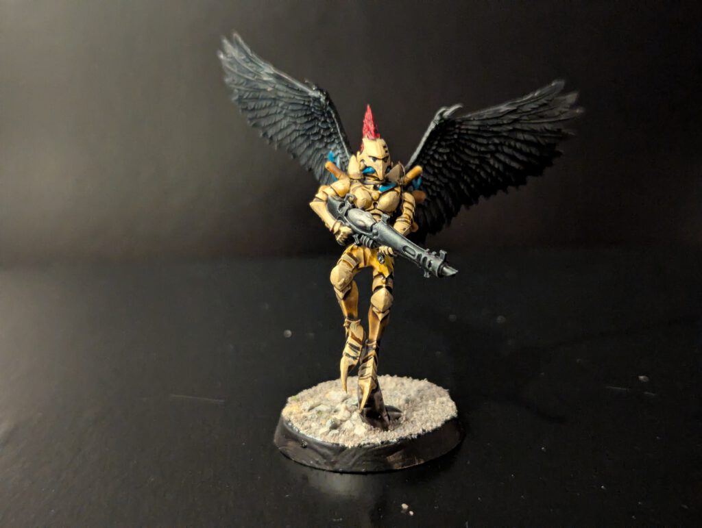 Painted Scourge with dynamic airborne pose, viewed from a slightly elevated front angle.