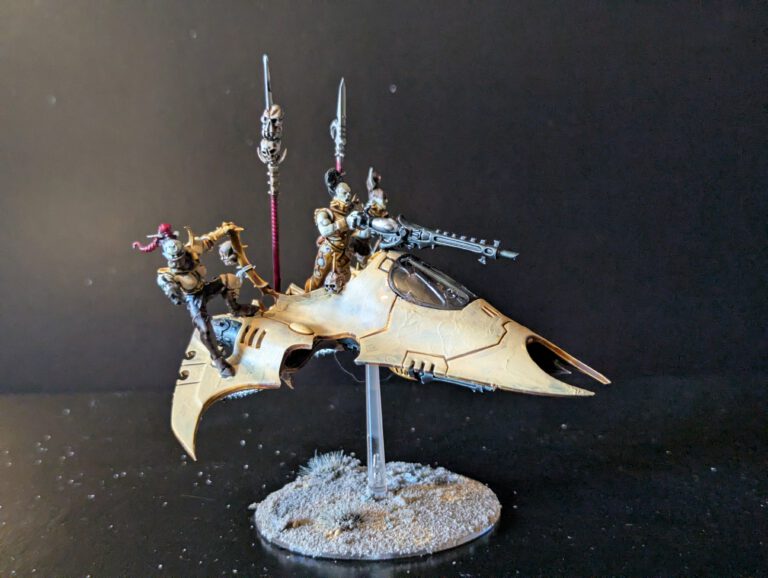 Painted Drukhari Venom transport viewed from the front-left angle.