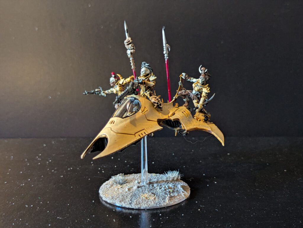 Painted Drukhari Venom transport viewed from the front-right angle.