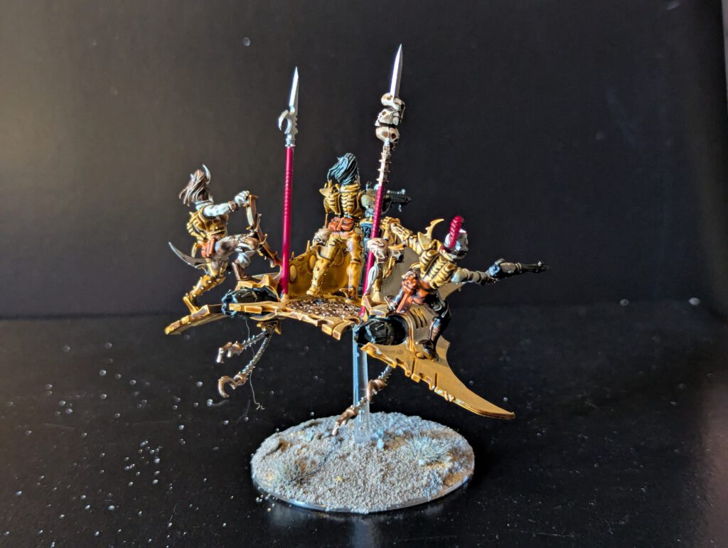Painted Drukhari Venom transport viewed from the rear-right angle.