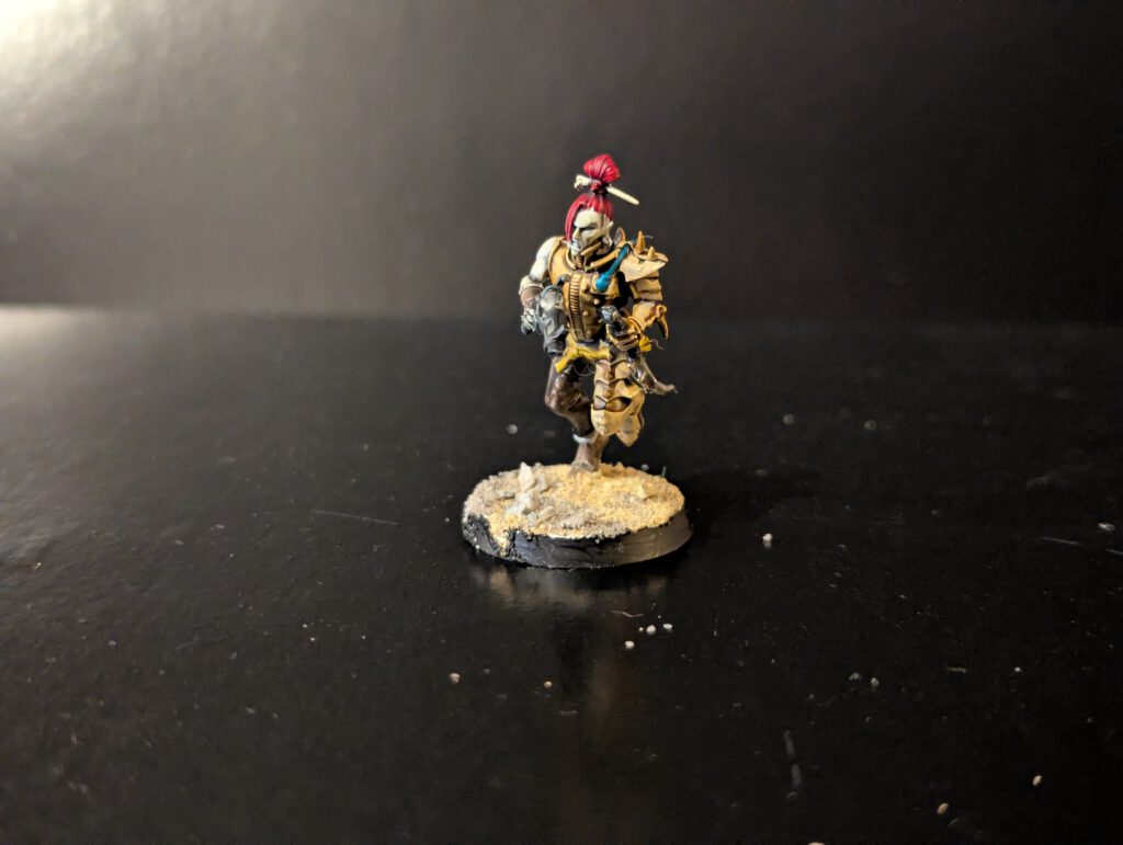 Painted Wych with dramatic combat pose, viewed from a front angle.