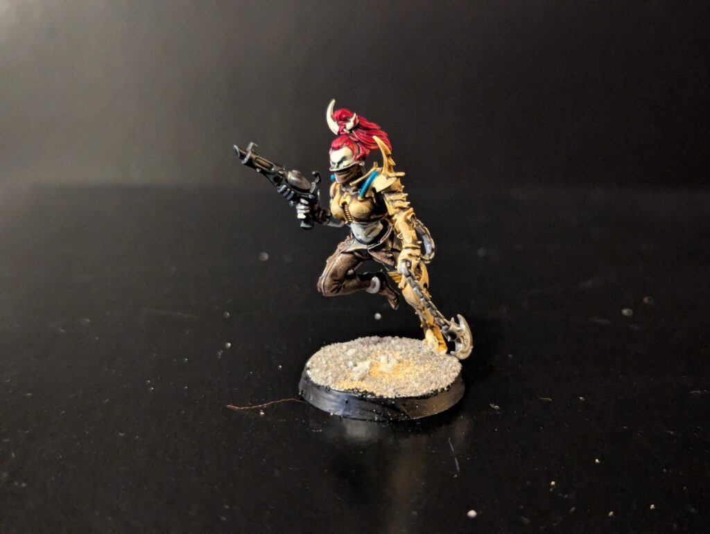 Painted Wych with aggressive pose and exposed armor, viewed from a front angle.