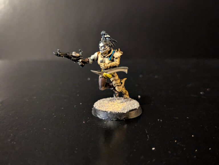 Painted Wych poised for attack, viewed from a slightly elevated front angle.