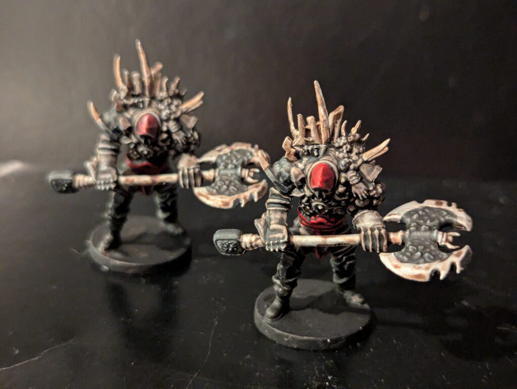 A pair of Animate constructs painted with aged bronze and glowing magical energy cores.