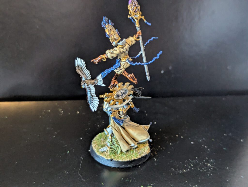 The reverse side of Ellania and Ellathor, showing the intricate cape work and other details of the Lumineth twins.