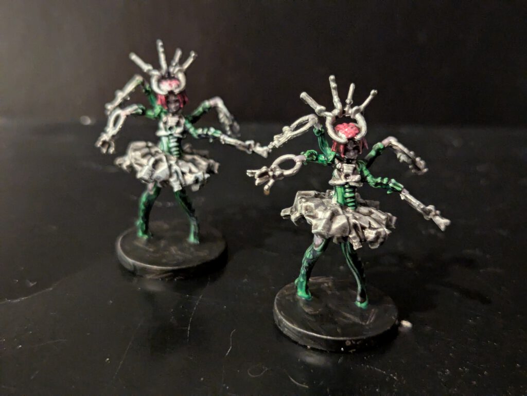 A pair of Gatekeeper miniatures featuring heavy metallic armor and intimidating poses.