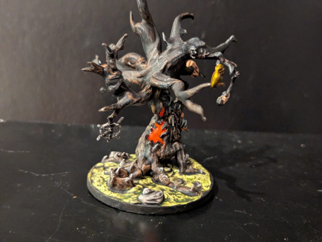 A massive Grotesque Effigy boss painted with fleshy textures and disturbing biological details.