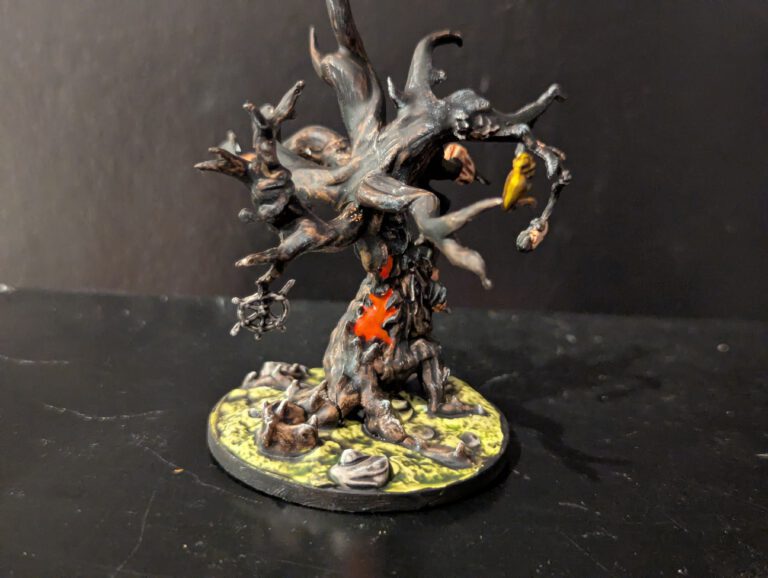 A massive Grotesque Effigy boss painted with fleshy textures and disturbing biological details.