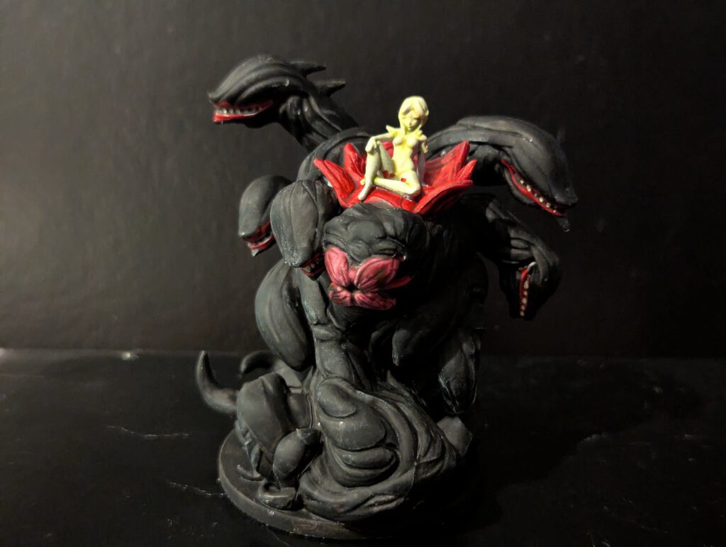 The terrifying Lich Wurm painted with Black bone textures and ethereal green magic.