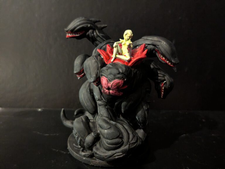 The terrifying Lich Wurm painted with Black bone textures and ethereal green magic.