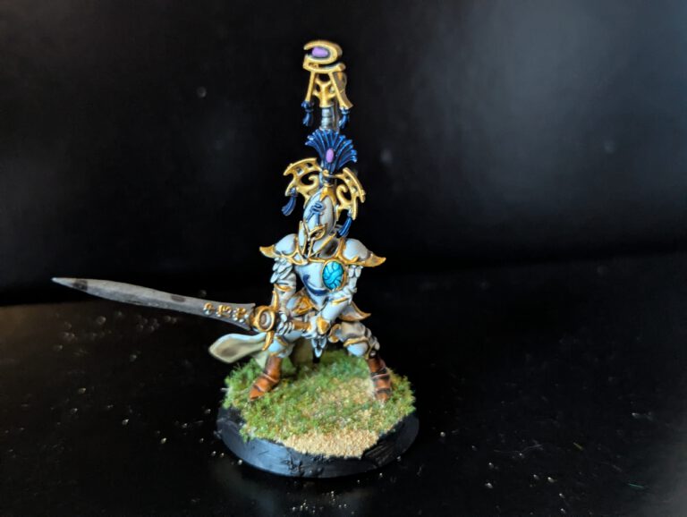 Final detail shot of a Bladelord miniature, focusing on the leather straps and metallic sunmetal finish on the blade