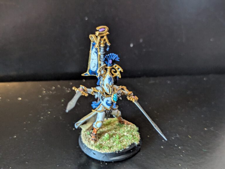 Close-up of a single painted Bladelord showing the fine gold trim on the armor and the sharp edge highlights on the sword.